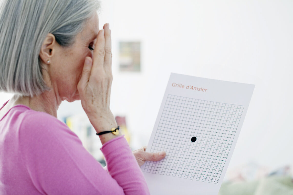 The old woman is checking her eyesight